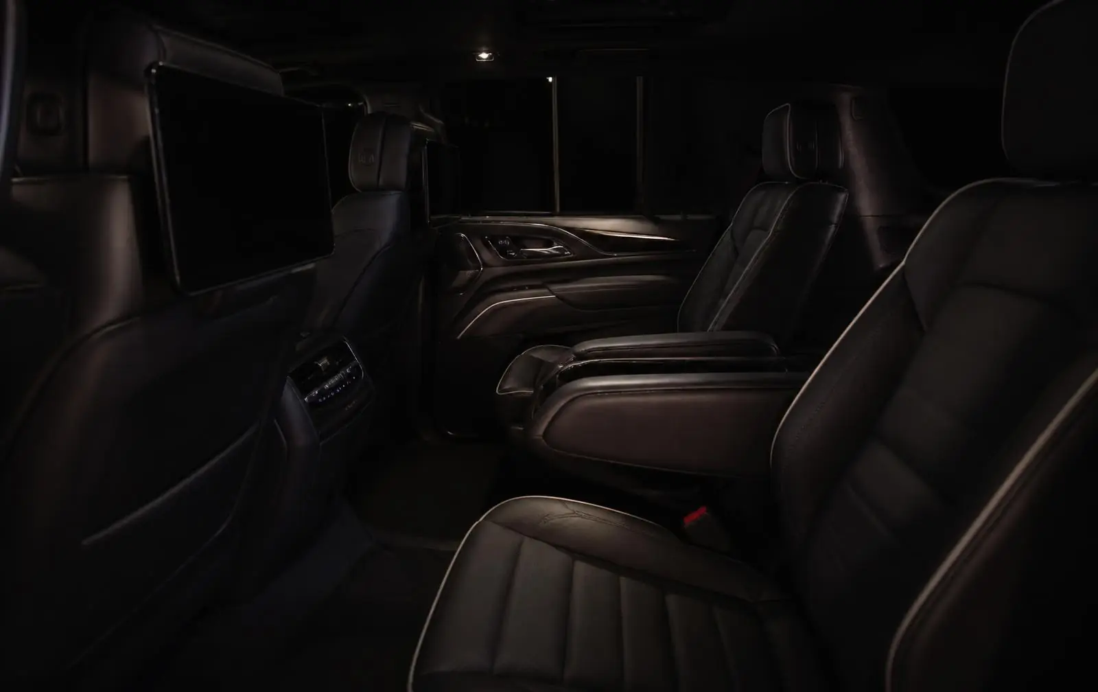 Dark leather rear cabin of the executive SUV