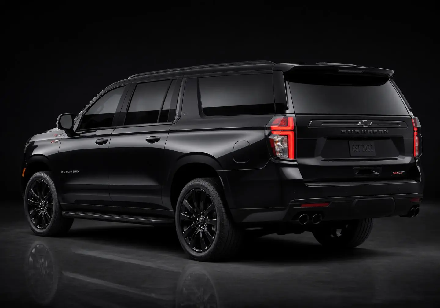 Rear three-quarter view of the black-on-black executive SUV